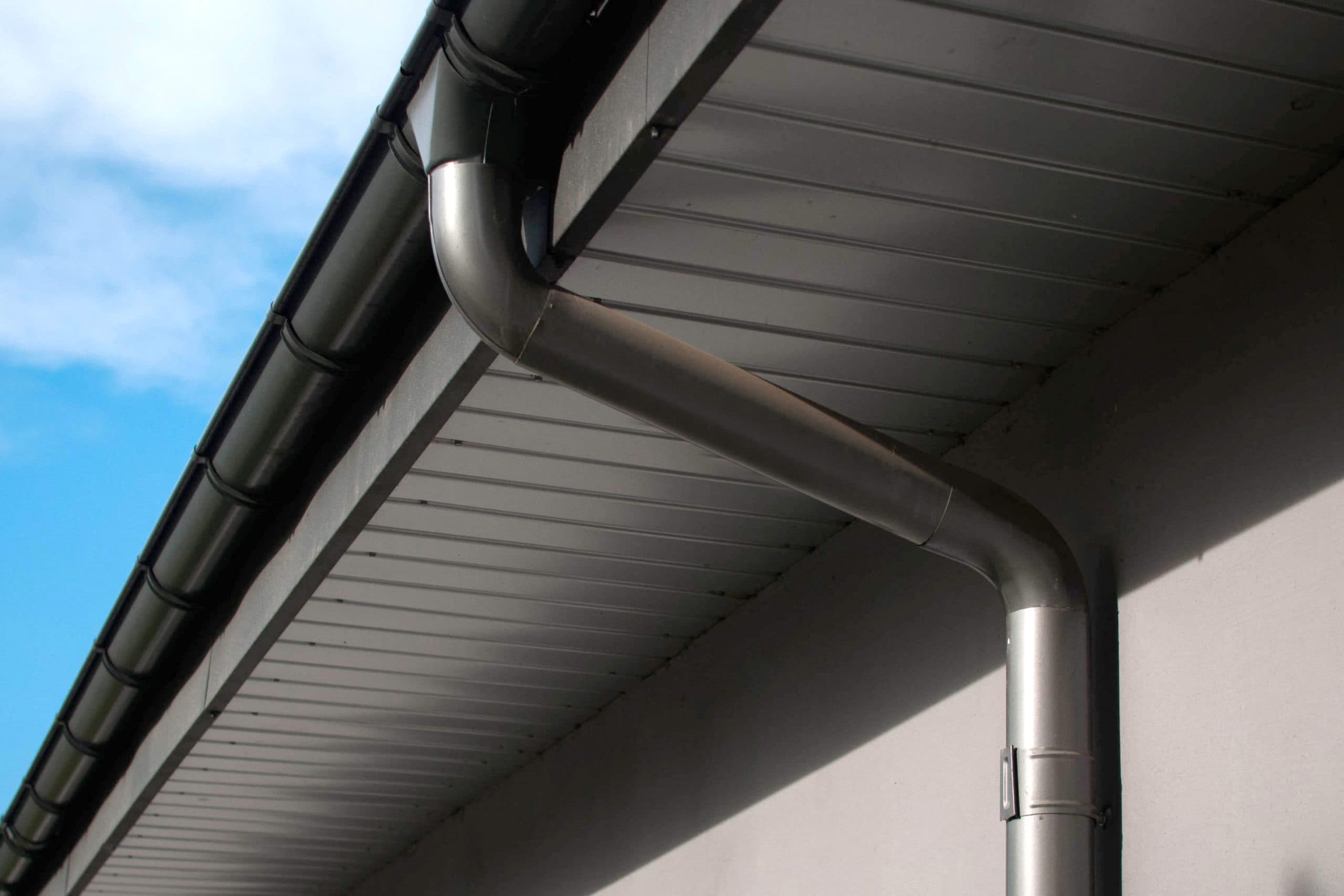 Corrosion-resistant galvanized gutters installed on a commercial building in St. Paul